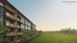 Developer render of the four-storey Amberwood at Holland block seen along its balcony facade, open lawn and treeline beyond