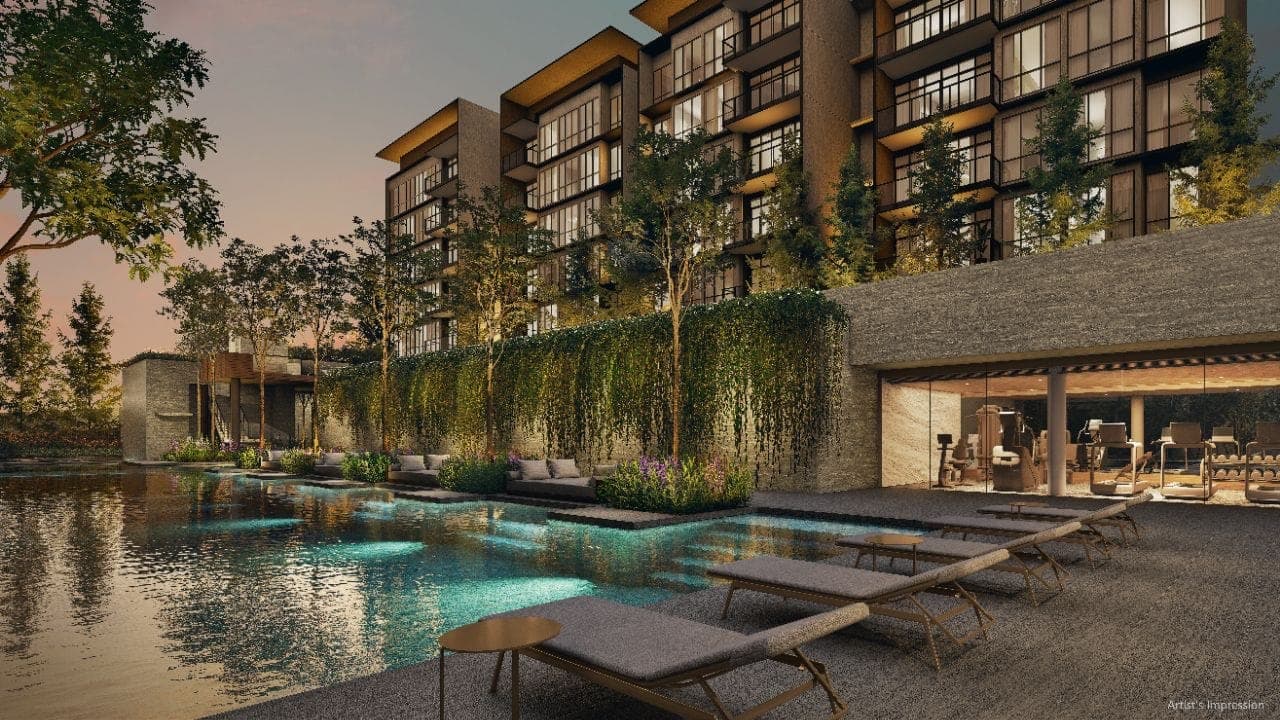 Developer render of the lakeside pool and loungers at dusk, with the glass-walled fitness studio beneath the deck