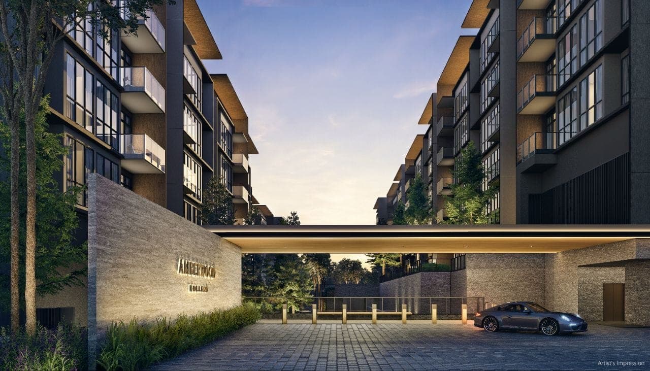 Developer render of the arrival plaza at dusk, the Amberwood name on a stone wall beside the covered drop-off