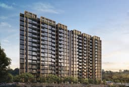 Developer render of the Narra Residences blocks at dusk, mature trees and a boundary path in the foreground
