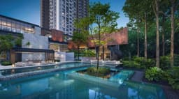 Developer render of the pool terrace at dusk, clubhouse to one side and the tower rising behind