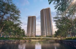 Developer render of the two River Modern towers at dusk, seen across the river with the arched footbridge in front