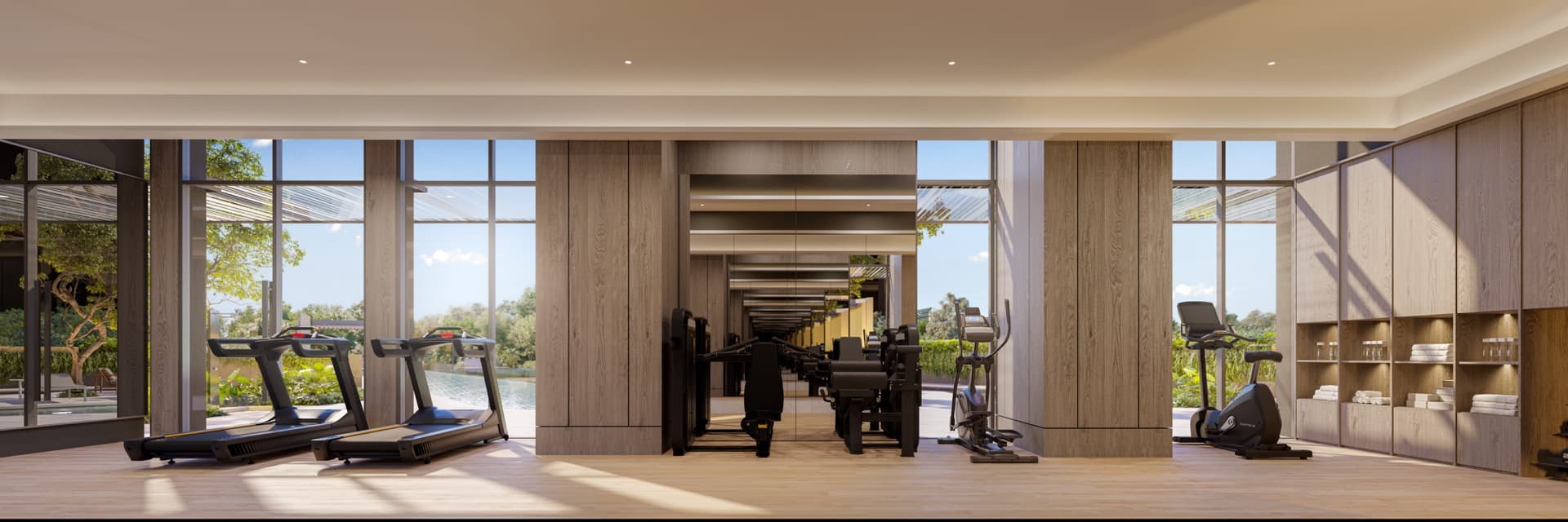 Developer render of the fitness room, treadmills and weight machines facing full-height windows onto greenery