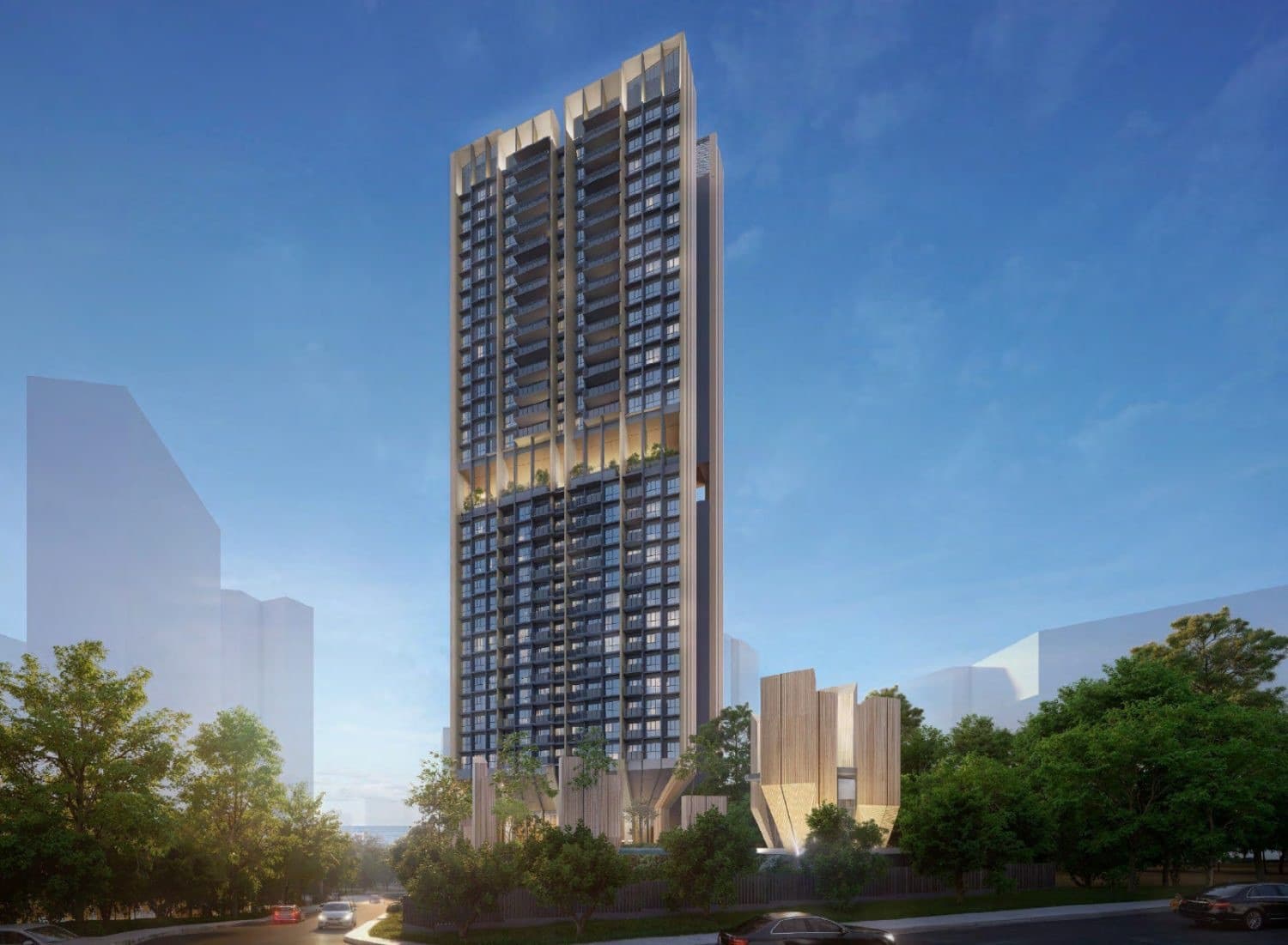 Developer render of the Serra Residences tower from street level, its ribbed columns opening at the base above the trees along Bassein Road