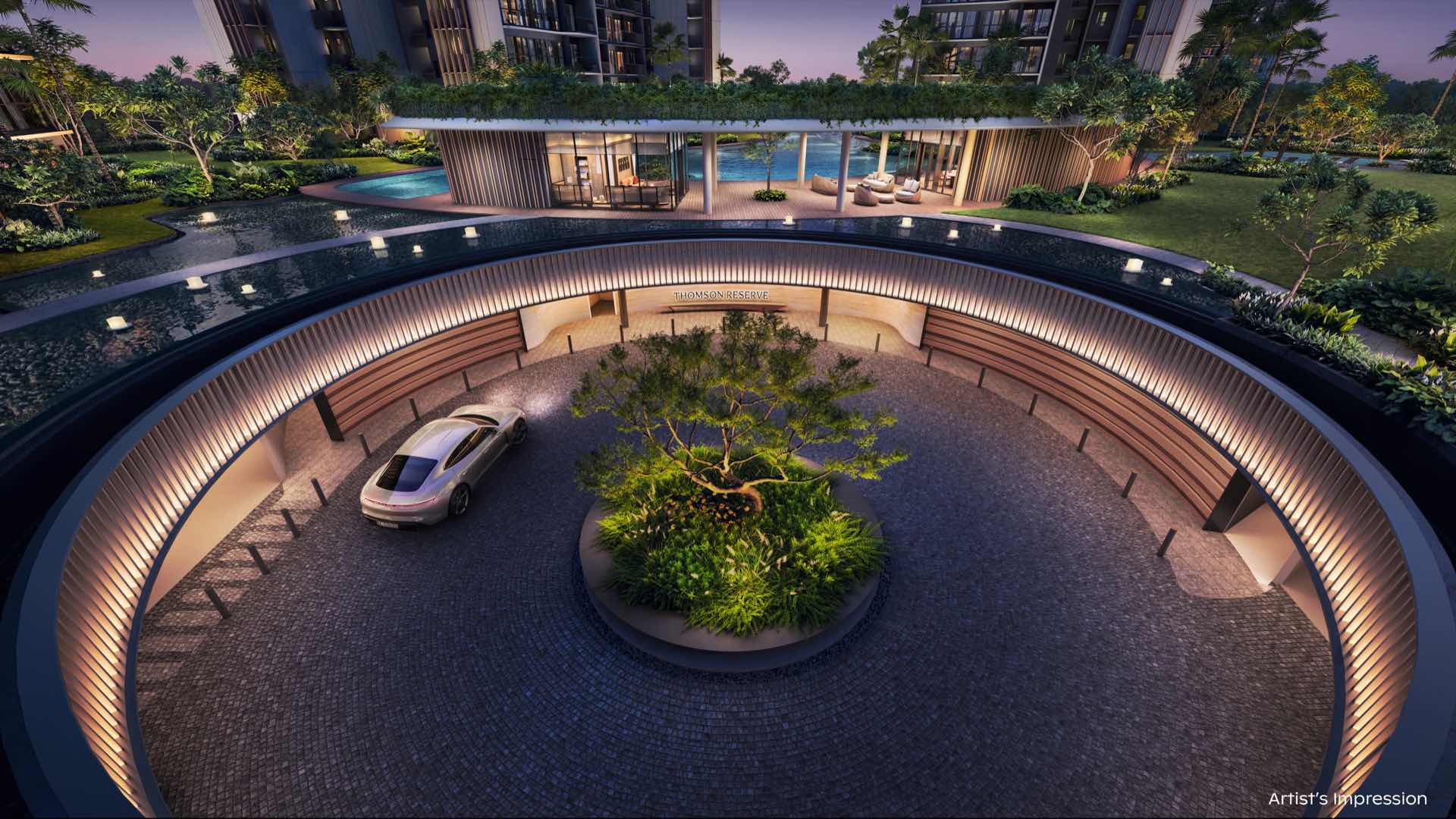 Developer render of the circular arrival court at dusk, a car beside a planted island under a curved, lit canopy