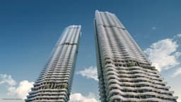 Developer render looking up at the two Zyon Grand towers against a clear sky, their balcony bands stacked in a continuous wave